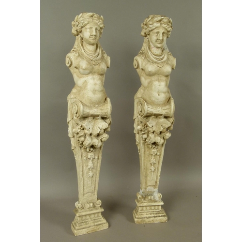 555 - A PAIR OF PLASTER TERMS, the heads with circlets of leaves, drapes to the neck above half female bod... 