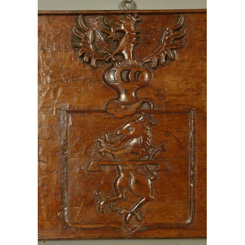 563 - A PAIR OF 19TH CENTURY OAK ARMORIAL carved rectangular panels each with a filled shield and crest, 3... 