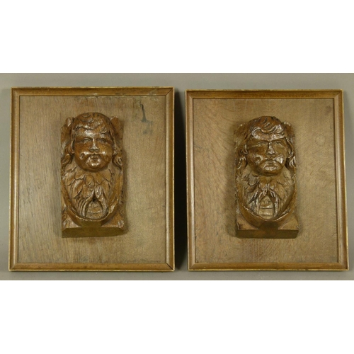 564 - A PAIR OF RECTANGULAR OAK PLAQUES each applied with a 17th century carving of an infant, garland and... 