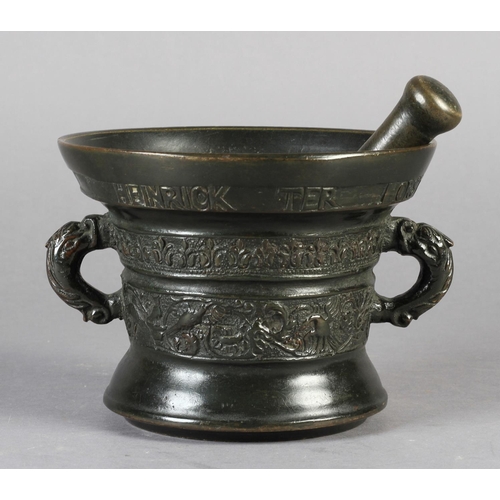 565 - A 17TH CENTURY DUTCH BRONZE PESTLE AND MORTAR of flared cylindrical form, the upper rim inscribed: H... 