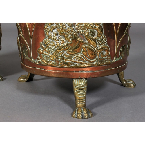 569 - A PAIR OF VICTORIAN TWO HANDLED COPPER CYLINDRICAL COAL BINS, the seamed bodies applied with lion an... 