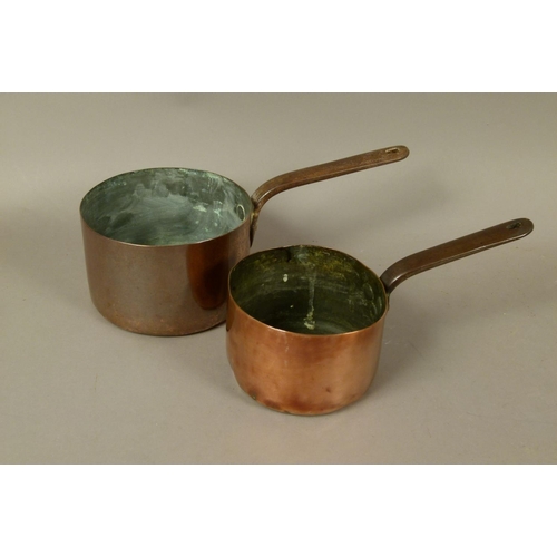 572 - TWO COPPER SAUCEPANS, 19th century, each having an iron strap handle, 18cm diameter x 11.5cm high an... 