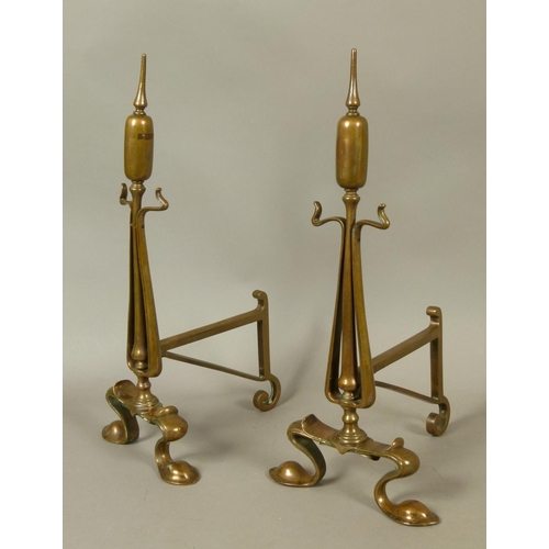 573 - A PAIR OF BRONZE ART NOUVEAU BULL RUSH ANDIRONS, scrolling feet, 48cm high, late 19th century