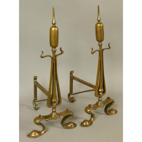 573 - A PAIR OF BRONZE ART NOUVEAU BULL RUSH ANDIRONS, scrolling feet, 48cm high, late 19th century