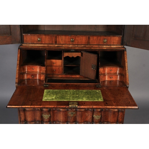 578 - A MID-TO LATE 18TH CENTURY WALNUT VENEERED BUREAU BOOKCASE, the arched top with cavetto moulded corn... 