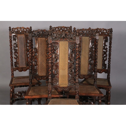 583 - A SET OF SIX CHARLES II STYLE WALNUT SIDE CHAIRS, 19th century pierced and foliate carved cresting f... 