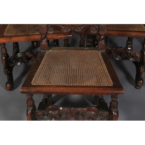 583 - A SET OF SIX CHARLES II STYLE WALNUT SIDE CHAIRS, 19th century pierced and foliate carved cresting f... 