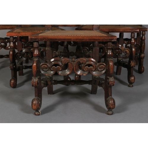 583 - A SET OF SIX CHARLES II STYLE WALNUT SIDE CHAIRS, 19th century pierced and foliate carved cresting f... 