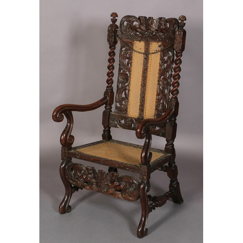 584 - A FLEMISH WALNUT ARMCHAIR 17TH CENTURY AND LATER, having a pierced cresting carved with foliate crow... 