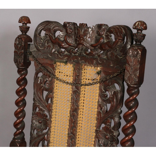 584 - A FLEMISH WALNUT ARMCHAIR 17TH CENTURY AND LATER, having a pierced cresting carved with foliate crow... 