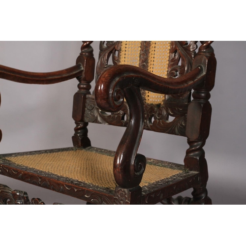 584 - A FLEMISH WALNUT ARMCHAIR 17TH CENTURY AND LATER, having a pierced cresting carved with foliate crow... 