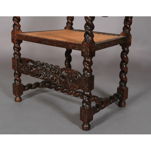 586 - A CHARLES II WALNUT ARMCHAIR 17TH CENTURY AND LATER, having a pierced cresting carved with an eagle ... 