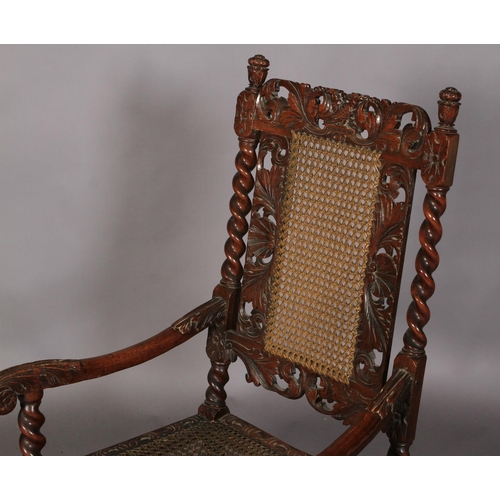 587 - A CHARLES II STYLE WALNUT ARMCHAIR 19TH CENTURY, having a pierced cresting carved with pair of birds... 