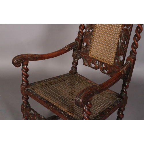 587 - A CHARLES II STYLE WALNUT ARMCHAIR 19TH CENTURY, having a pierced cresting carved with pair of birds... 