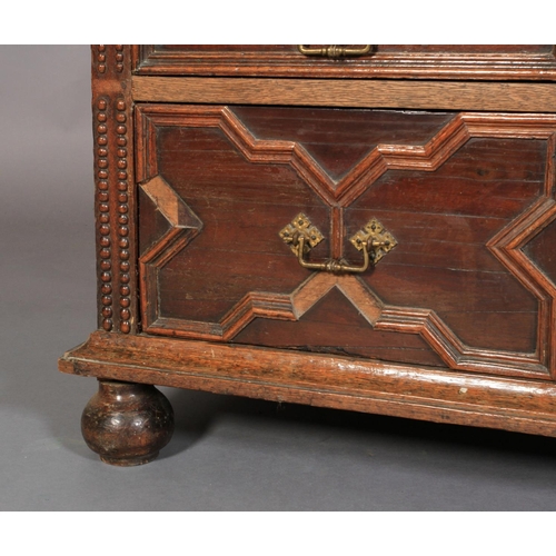 590 - A CHARLES II OAK AND CEDARWOOD CHEST, having a moulded top above alternating shallow and deep drawer... 