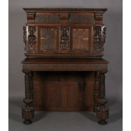 591 - AN OAK SERVING TABLE in 17th century style, the projecting canopy above a deep frieze with applied d... 