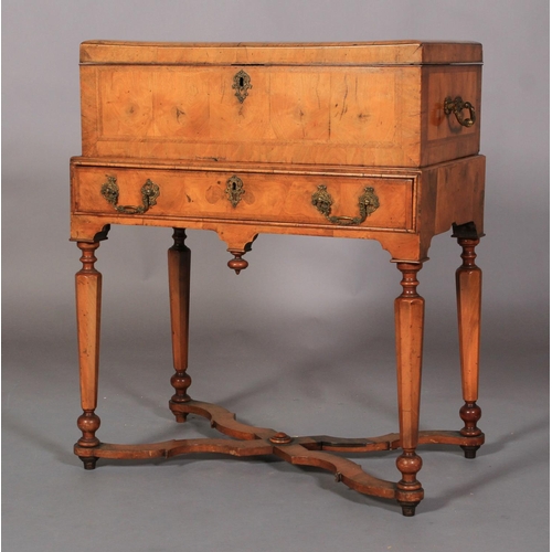 599 - A QUEEN ANNE WALNUT BOX ON STAND, the hinged lid cushion moulded and butterfly veneered within chevr... 