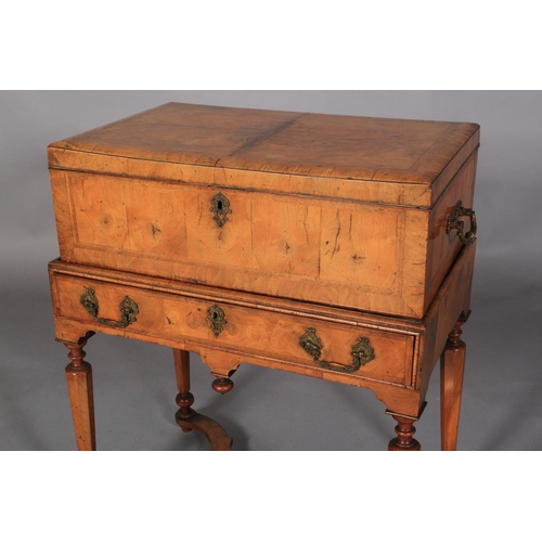 599 - A QUEEN ANNE WALNUT BOX ON STAND, the hinged lid cushion moulded and butterfly veneered within chevr... 