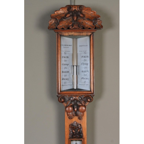 60 - A VICTORIAN OAK STICK BAROMETER with oak leaf and acorn cresting, the silvered register inscribed Ch... 