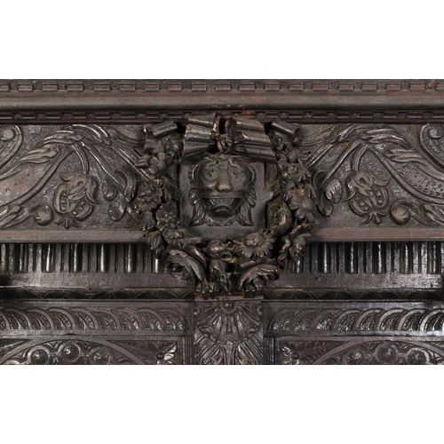 602 - AN OAK DRESSER/CUPBOARD in 16th century style, dentil moulded cornice above a frieze centred on a gr... 