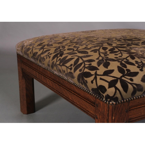 613 - AN OAK SQUARE FOOT STOOL with moulded frame and chamfered square legs, the stuffed over top upholste... 