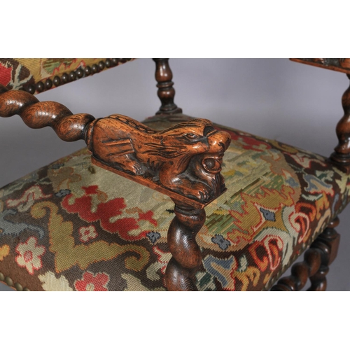 615 - A VICTORIAN OAK ELBOW CHAIR in late 17th century style, the barley twist turned arms terminating in ... 