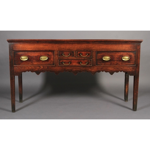 616 - AN EARLY 19TH CENTURY FRUITWOOD DRESSER BASE, having a bead rail to the surface above two short and ... 