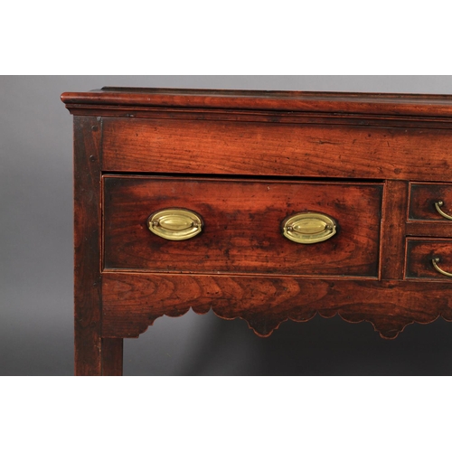 616 - AN EARLY 19TH CENTURY FRUITWOOD DRESSER BASE, having a bead rail to the surface above two short and ... 