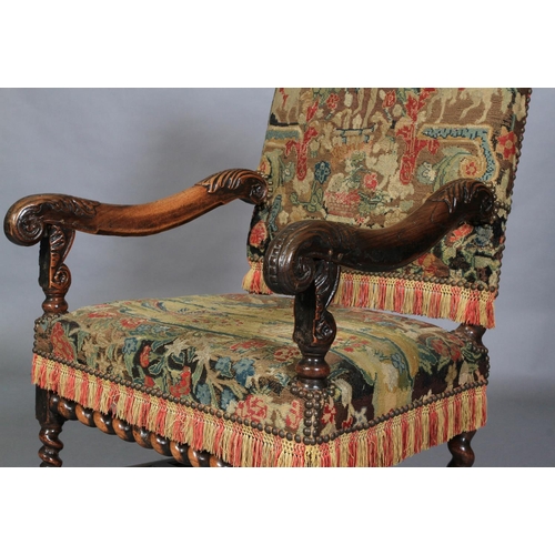 623 - A WALNUT OPEN ARMCHAIR, 17th century and later, the rectangular high back and seat upholstered in ne... 