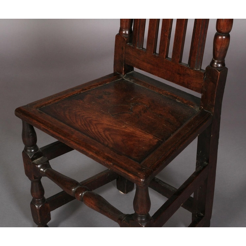 626 - A LATE 17TH CENTURY OAK SINGLE CHAIR c.1690 having a pierced and scrolled cresting above a slate bac... 