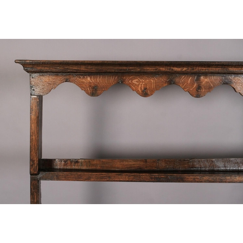 628 - A 19TH CENTURY DRESSER AND RACK, having a moulded cornice above a scalloped frieze, the open back wi... 