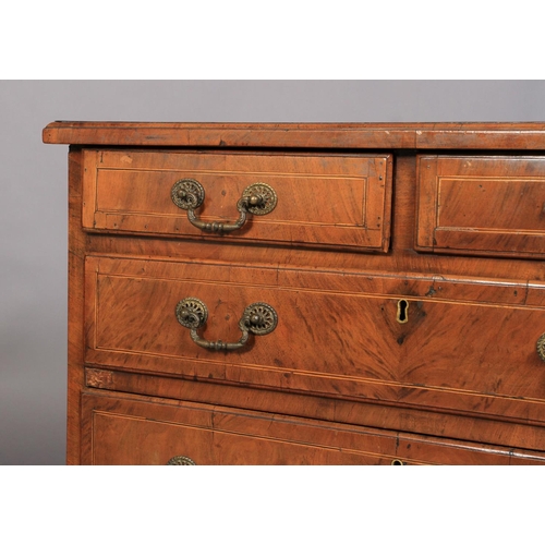 634 - A GEORGE III WALNUT DWARF CHEST OF DRAWERS crossbanded and inlaid in boxwood and ebony stringing, th... 