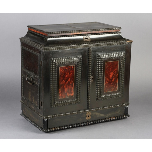 65 - A FLEMISH EBONY VENEERED TABLE CABINET late 17th century, the hinged top above a cavetto frieze and ... 