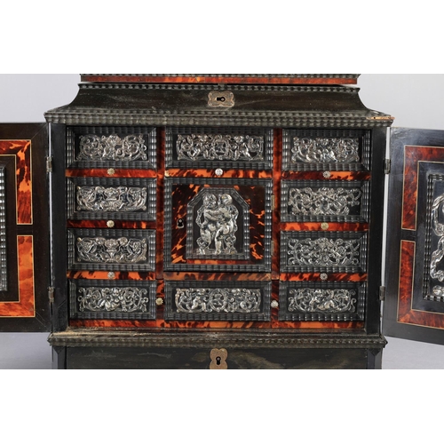 65 - A FLEMISH EBONY VENEERED TABLE CABINET late 17th century, the hinged top above a cavetto frieze and ... 