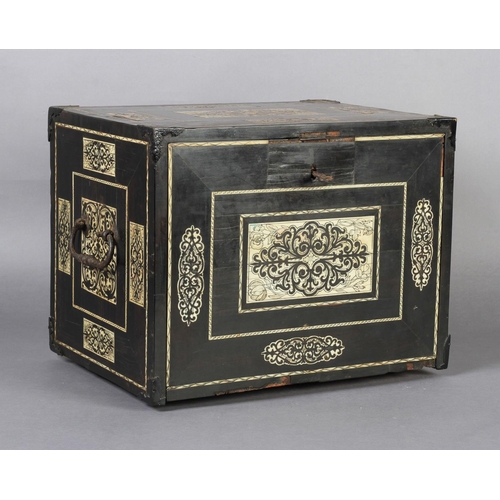 68 - AN EARLY 17TH CENTURY GERMAN EBONY VENEERED AND IVORY INLAID TABLE CABINET inlaid with rectangular a... 