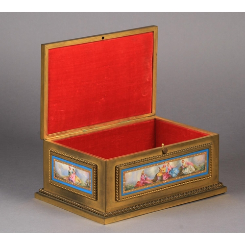 69 - A FRENCH GILT BRASS JEWEL CASKET c.1870 rectangular, the lid and all four sides mounted with Sevres-... 