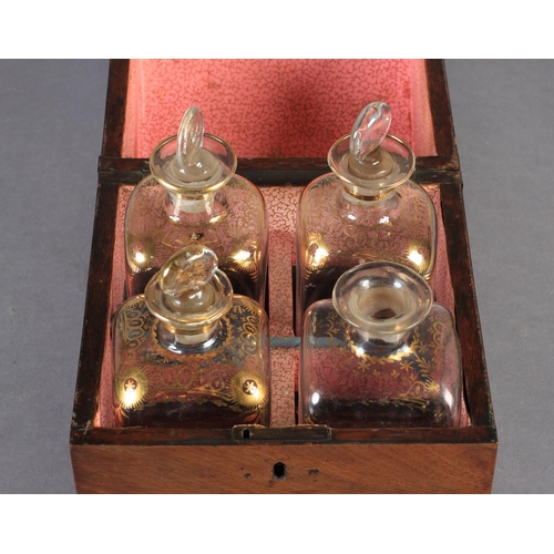 70 - A DUTCH MAHOGANY DECANTER BOX c.1810, having a cylinder hinged lid, the interior fitted with four gi... 