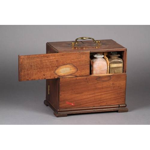 71 - A GEORGE III MAHOGANY APOTHECARY'S CABINET the divided hinged front enclosing a fitted interior of d... 