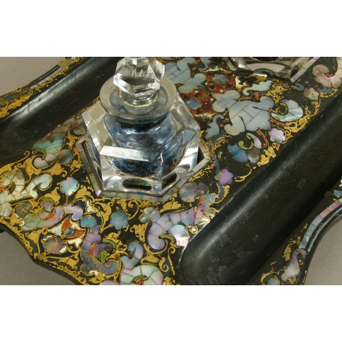 73 - A VICTORIAN PAPIER MACHE DESK STANDISH having painted and mother-of-pearl decoration, twin pen slide... 