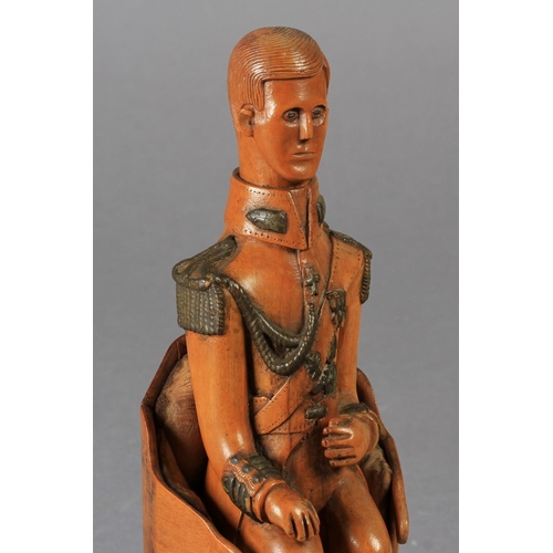 74 - A NAIVE CARVED WOODEN FIGURE OF A SEATED MILITARY GENTLEMAN, his uniform with detail of epaulettes, ... 