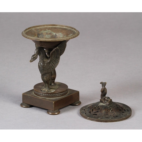 81 - A SMALL 19TH CENTURY BRONZE BRAZIER of shallow urn form on a pedestal base, the single swan mount wi... 