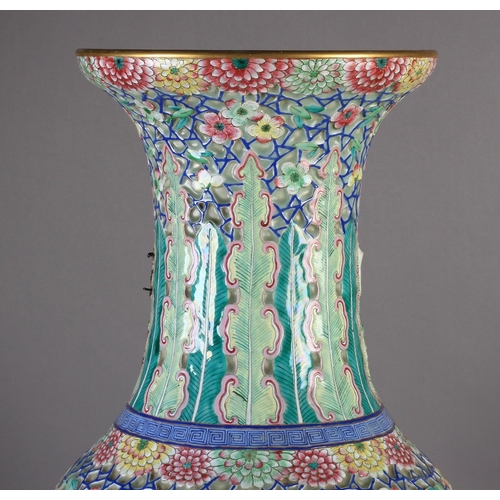 86 - A LARGE CANTONESE VASE c.1850, the baluster form painted with figures on a terrace within a gilt-lin... 