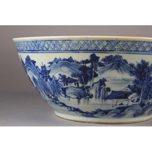 90 - A LARGE CHINESE BLUE AND WHITE BOWL 19th century painted to the exterior with a continuous pagoda an... 