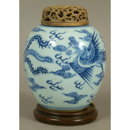 94 - A CHINESE BLUE AND WHITE JAR, the baluster body painted with phoenix amidst stylised clouds, later p... 