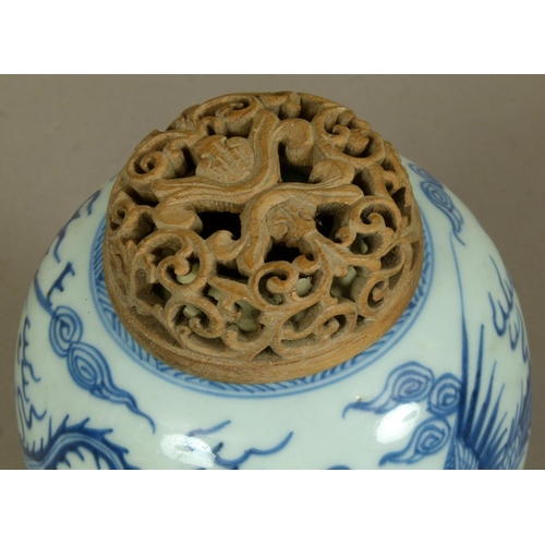 94 - A CHINESE BLUE AND WHITE JAR, the baluster body painted with phoenix amidst stylised clouds, later p... 