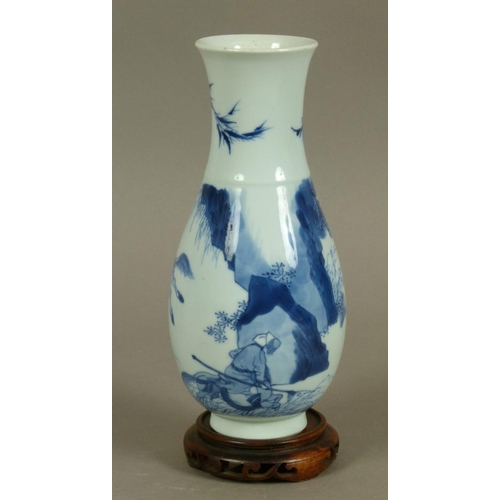 96 - A CHINESE BLUE AND WHITE BALUSTER VASE painted in underglaze blue with hunters on horseback with dog... 