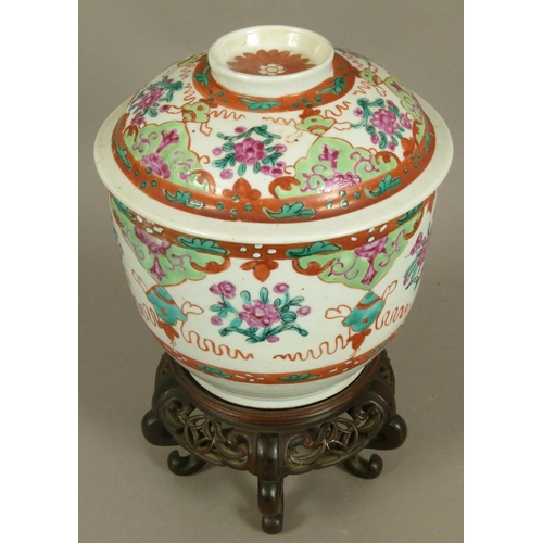 97 - A CHINESE FAMILLE ROSE DECORATED JAR AND COVER alternately painted with flowers, leafage and ribbon ... 