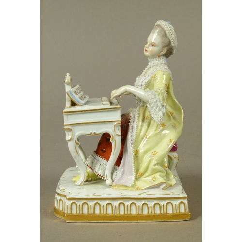 165B - A Meissen figure of a young woman playing a harpsicord, allegorical of sound, gilt detail to the bow... 