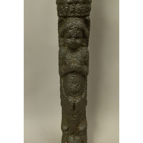 567 - A CAST IRON DOUBLE FIGURAL ORNAMENT, cast with headless figure above an infant, his hands clasped be... 