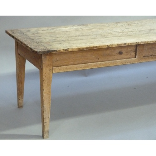 619 - A FRENCH OAK FARMHOUSE TABLE, having a planked top with cleat ends, the apron having a small drawer ... 